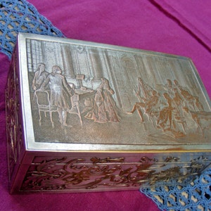 Silver-plated copper trinket box, wood paneling interior, early 20th century, detailed embossing, etching