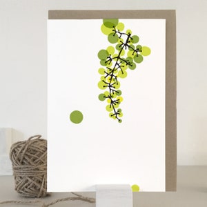 May include: A white card with a green and yellow abstract design of a vine with circles. The vine is on the right side of the card and there is a single green circle on the left side of the card.