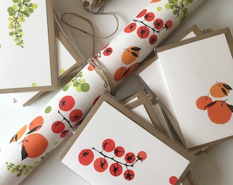May include: A stack of blank greeting cards with brown envelopes. The cards feature a variety of colourful illustrations, including grapes, tomatoes, and oranges. The cards are perfect for sending a handwritten note to a loved one.