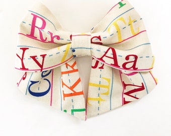 Alphabet Hair Bow, Cream Fabric with Rainbow Letters