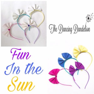 May include: Set of six colorful fabric headbands with bows. Each headband has a different color bow, including pink, blue, yellow, and purple. The headbands are perfect for adding a touch of fun to any outfit.