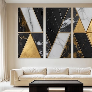 May include: A set of six abstract wall art panels. Each panel features a geometric design with triangles in black marble, white marble, and gold metallic accents. The artwork is displayed above a cream-colored sofa and a black coffee table.