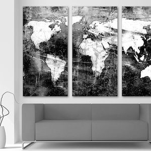 May include: A black and white world map print with a distressed, textured look. The map is split into three panels, creating a modern and abstract design.