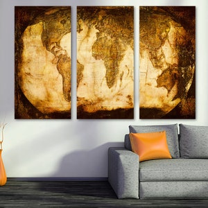 May include: A vintage-style world map print in three panels, with a distressed, aged look. The map is in shades of brown and beige, with a dark brown border. The map is displayed on a wall above a gray sofa.