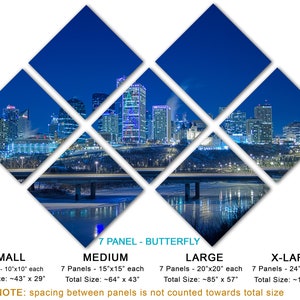 May include: A seven-panel wall art piece featuring a nighttime cityscape with illuminated buildings and a bridge over a body of water. The panels are arranged in a butterfly pattern. Available in small, medium, large, and x-large sizes.