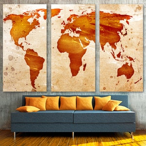 May include: A three-panel canvas print featuring a vintage-style world map in shades of orange and brown on a textured beige background.