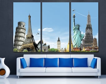 May include: A multi-panel canvas print featuring iconic landmarks from around the world, including the Eiffel Tower, the Statue of Liberty, Big Ben, and the Leaning Tower of Pisa. The print is set against a blue sky with white clouds and features airplanes flying overhead.