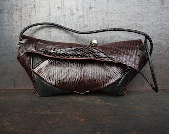 Sculpted Sophistication: The Dual-Tone Exotic Leather Clutch. Lizard and python evening clutch, hand stitched purse.