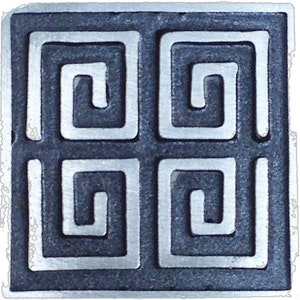 May include: A square tile with a raised design of four interlocking Greek key patterns. The tile is made of a dark gray material with a silver metallic finish.
