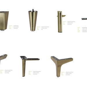 May include: Assortment of six gold metal furniture legs in various styles.  The legs are all brushed brass and have a vintage look.  The legs are 10 cm (4 inches) tall.
