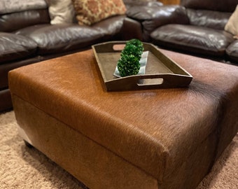 Stylish and Functional Cowhide Storage Ottoman: The Perfect Addition to your Home Decor