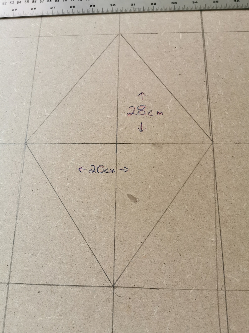 This picture shows the diamond shape being mapped out on the wood of the headboard.