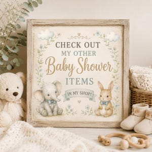 May include: A square wooden sign featuring the text "CHECK OUT MY OTHER Baby Shower ITEMS IN MY SHOP!" decorated with illustrations of a baby elephant and a rabbit, surrounded by floral vines, clouds, and small hearts in soft pastel colors.