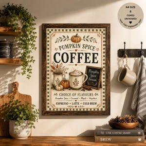 May include: A rectangular wall art print in a dark wood frame featuring the text PUMPKIN SPICE COFFEE. The design includes illustrations of two mugs, pumpkins, and cinnamon sticks, with a list of flavours including Espresso, Latte, and Cold Brew.