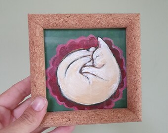 Gatito tímido, pequeño cuadro original de un gato blanco durmiendo. Ideal para los amantes de los gatos o como regalo para un amigo. Incluye marco.