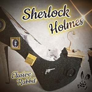 May include: A black high-heeled shoe with glitter, decorated with miniature furniture, a magnifying glass, a gun, and framed pictures. The shoe is labeled "Elusive Rabbit" and "Sherlock Holmes".