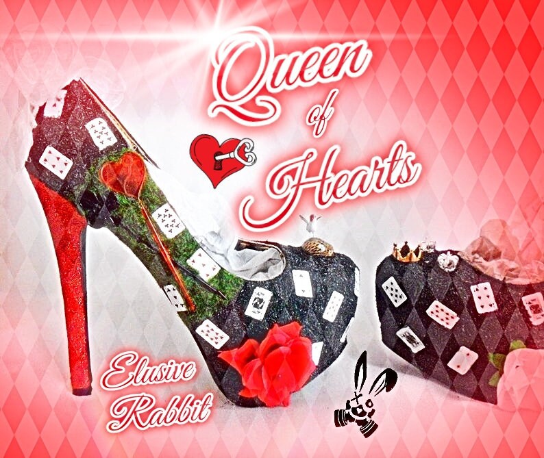 May include: A pair of high-heeled shoes decorated with playing cards and a red rose. The shoes are black with red accents and the text "Queen of Hearts" and "Elusive Rabbit" is visible.