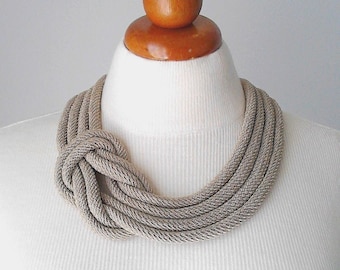 Statement necklace for women. Bib necklace with rope and knot in nautical style. Trendy necklaces for stylish women. Contemporary jewelry.