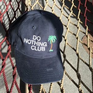 Do Nothing Club - Navy Hat with White Letters (President With A Palm Tree On The Back)