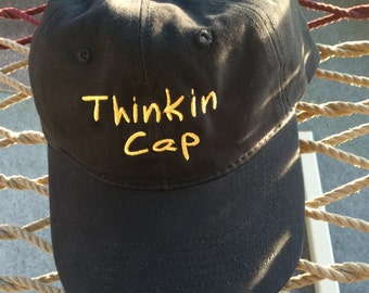Thinkin Cap - Black w/Gold Lettering - Reverses to say "Not Thinkin" on the back