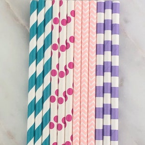 May include: A set of 10 paper straws with different patterns. The straws are white with teal, pink, and purple stripes, polka dots, and chevron patterns.
