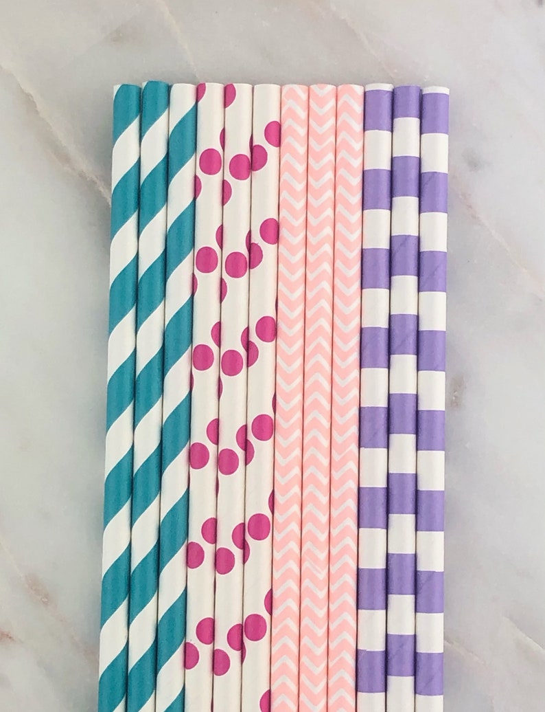 May include: A set of 10 paper straws with different patterns. The straws are white with teal, pink, and purple stripes, polka dots, and chevron patterns.