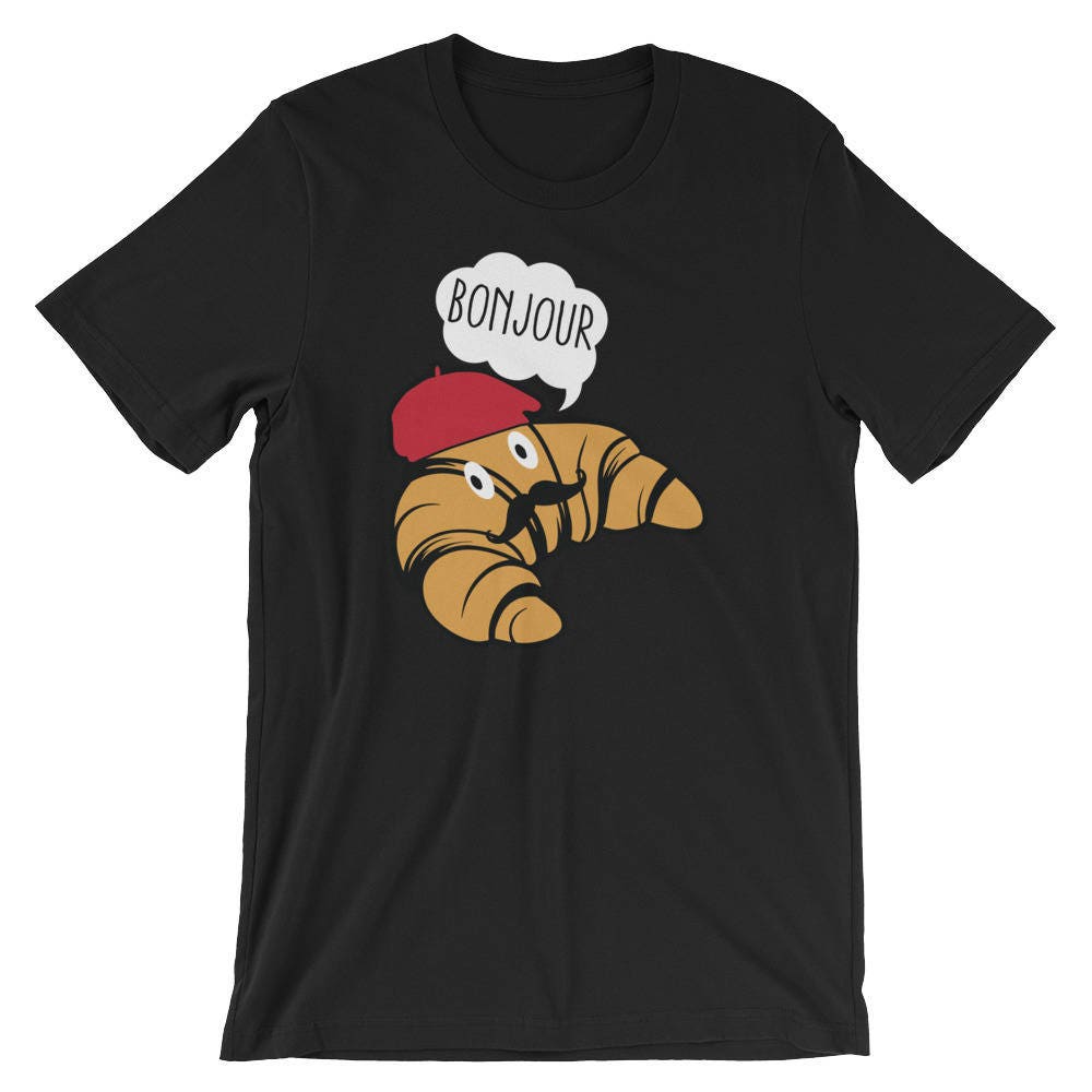 Discover Maglietta T-Shirt Croissant Con Baffi E Berretto Cappello Uomo Donna Bambini Bonjour Francia Cibo Amante Divertente Umorismo Migliore Regalo