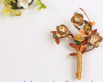 Grooms buttonhole, orange pip berries, brown gold Cherry Blossoms, mustard yellow roses Ideal Autumn wedding