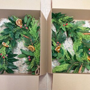 Fresh Christmas garland, mantlepiece. scented dried oranges, Bay leaves, evergreen fir, red berries, cinnamon sticks. Smells divine image 3