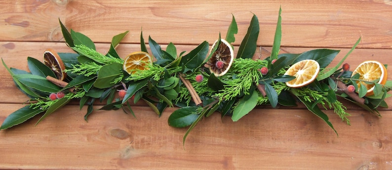 Fresh Christmas garland, mantlepiece. scented dried oranges, Bay leaves, evergreen fir, red berries, cinnamon sticks. Smells divine image 4