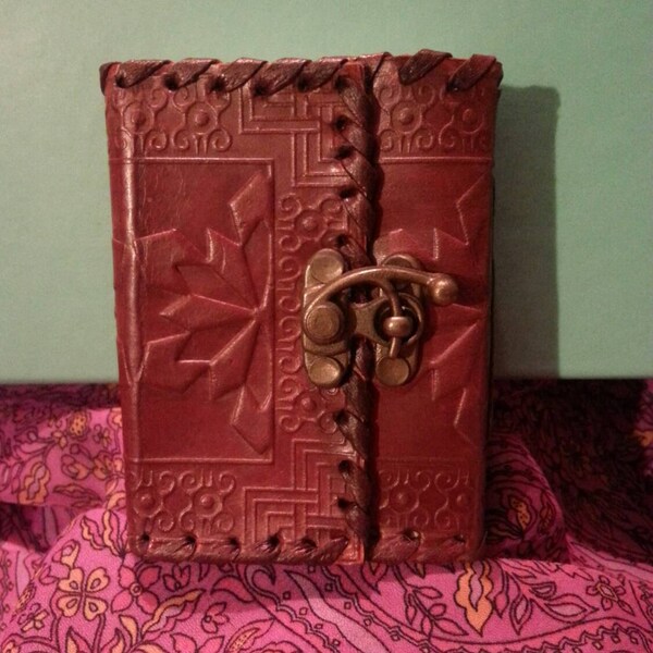Handmade mini leather journal or sketch book with recycled paper. Snowflakes