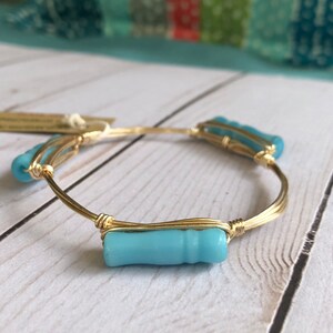 Soft blue glass bead wire wrapped gold bangle inspired by Bourbon and Bowties inpired style