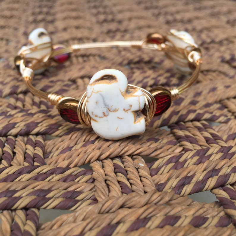 red The Bali Bangle wire wrapped on a gold bangle.Bourbon and bowties inspired style elephant bead flanked with crimson /& gold beads