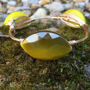 The Artichoke Bangle, three mustard yellow/olive green beads wire wrapped on gold wire, inspired by Bourbon and Bowties.