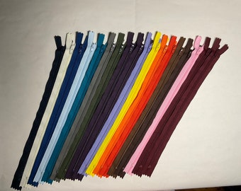 Set of 18 - 12 inch ,#3 nylon coil, YKK® zippers. Assorted Colors