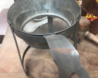 Vintage canning strainer in holder
