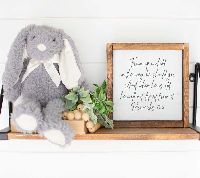 This is a mockup of what this Proverbs 22:6 unframed poster could look like framed in a nursery or kids room. This Proverbs 22:6 unframed print says, Train up a child in the way he should go, and when he is old, he will not depart from it.