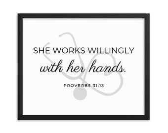 May include: A black framed print with a white background and a gray stethoscope graphic. The text reads "She works willingly with her hands. Proverbs 31:13"