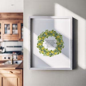 May include: A white framed print with a watercolor illustration of a wreath of lemons and green leaves. The text inside the wreath reads "The fruit of the Spirit is love, joy, peace, patience, kindness, goodness, faithfulness, gentleness, self-control. Galatians 5:22-23."