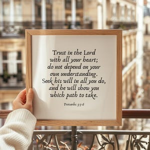 May include: A framed print with a white background and black text. The text reads: "Trust in the Lord with all your heart; do not depend on your own understanding. Seek his will in all you do, and he will show you which path to take. Proverbs 3:5-6"