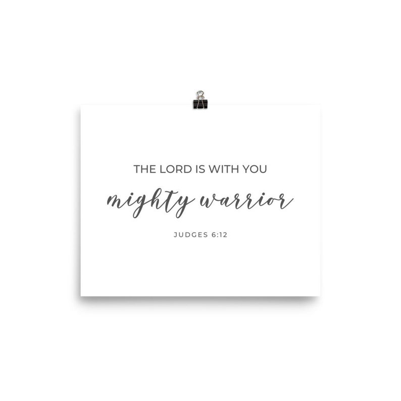 May include: A white printable poster with the text "The Lord is with you mighty warrior" and the scripture reference "Judges 6:12".