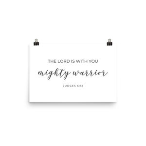 May include: White poster with black text that reads "The Lord is with you mighty warrior" and "Judges 6:12".