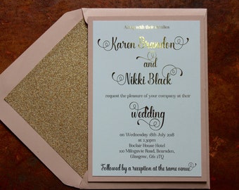 Luxury gold and blush pink day or evening invitations with glitter lined envelopes.