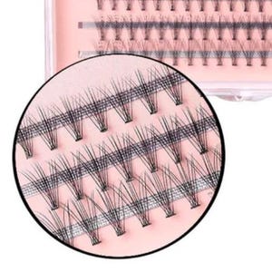 Könnte beinhalten: Eine Packung ZIDIA Luxury Cluster Lashes. Die Verpackung ist hellrosa mit schwarzem Text. Die Wimpern sind schwarz und in Clustern angeordnet. Eine Nahaufnahme zeigt die einzelnen Wimperncluster. Die Packung enthält 100 Wimpern.