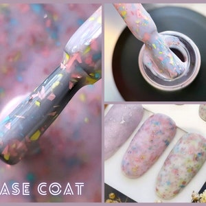 May include: A close-up of a bottle of nail polish with a pink base and multi-coloured glitter. The bottle is labelled "BASE COAT". The image also shows a hand with several nails painted with the same polish.