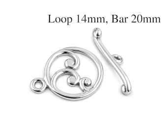 May include: A silver-toned toggle clasp consisting of a circular ring with an internal swirling pattern and a separate curved bar component. The text Loop 14mm, Bar 20mm is visible above the jewelry findings, indicating the specific measurements.