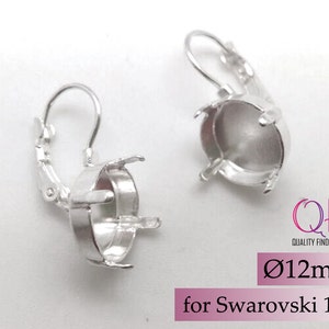 May include: Silver earring settings for 12mm round stones. The settings are designed to fit Swarovski 1122 crystals.  The earrings have a lever back closure.