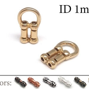 May include: Gold-toned metal connector with a 1 mm inner diameter. The connector has a loop on one end and two cylindrical sections on the other.  ID 1mm. Colors: copper, silver, gold, antique brass.