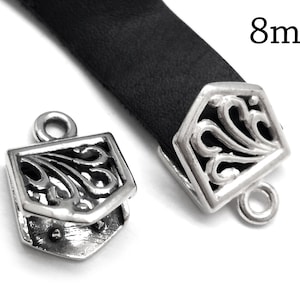 May include: Silver-toned metal clasp with an ornate design, suitable for leather straps. The clasp is 8mm wide.