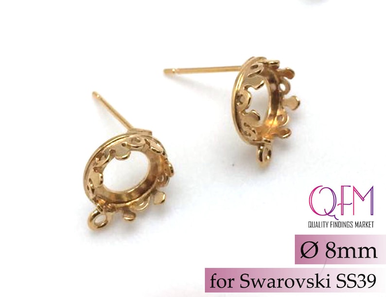 May include: Two gold-tone earring settings with a crown-shaped design. The settings are 8mm in diameter and are designed to hold Swarovski SS39 crystals.  The settings have a loop at the bottom for attaching to an earring finding.